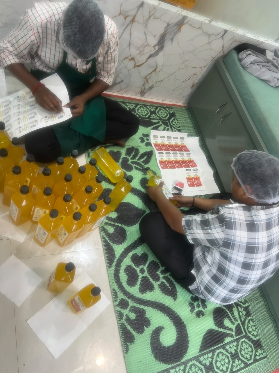 The team holding bottles in front of the oil shelf
